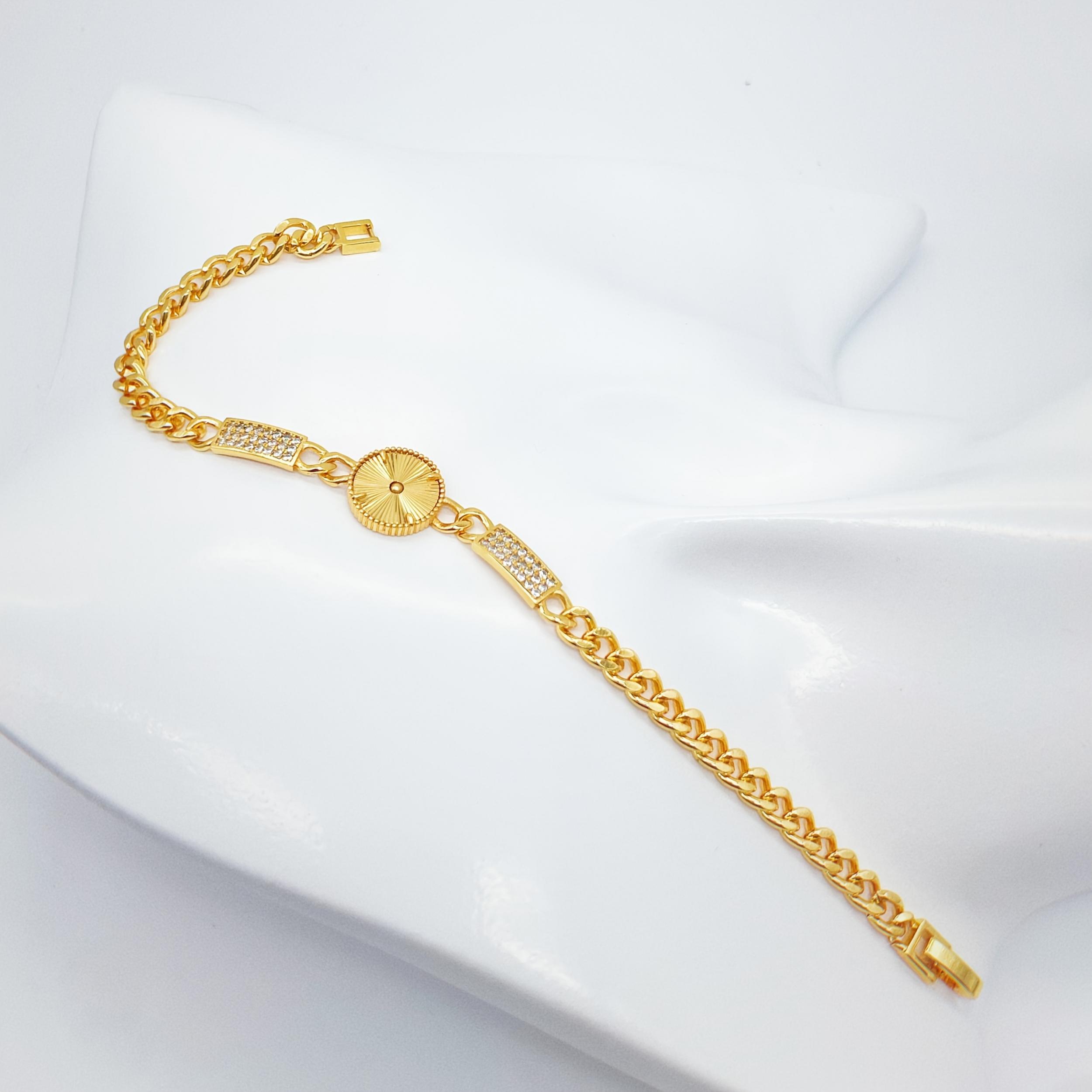 Golden Tone Bracelet with Sunburst Charm & Cubic Zirconia Accents